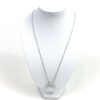Necklace displayed on a white bust to show the drop