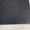 Embossed monogram pattern on the black base