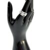 Band worn on the finger of a black display hand