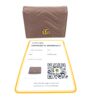 Wallet shown with its Entrupy certificate of authenticity and QR code