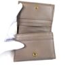 Wallet held open showing the full row of card slots