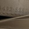 Serial numbers 466492 and 525041 embossed inside the wallet