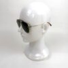 Sunglasses on a display head, seen in profile