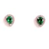 Close view of the pear cut emeralds and their halos