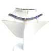 Necklace shown on a white display neck form
