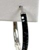 Single hoop showing the black pave set along the outer edge