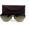 Sunglasses in front of the brown Gucci monogram case