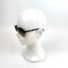 Sunglasses on a display head, seen in profile