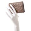 Marmont card case held in a display hand to show its size