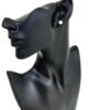 One stud worn on the ear of a black display bust