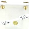 Backs of the studs with the friction posts and tag