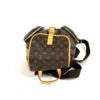 Side view showing the front pocket and the strap