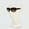 Sunglasses worn on a display head, seen at an angle