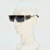 Sunglasses on a display head, seen in profile