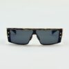 Front view showing the squared lenses and gold rivets