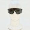 Sunglasses worn on a display head from the front