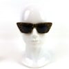 Sunglasses shown front on a white display head