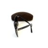 Folded frames beside the brown suede case