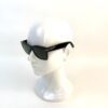 Sunglasses on a display head, seen in profile