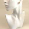 Profile of the display bust wearing the Pop H earring
