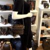 Mannequin holding the Vanity by its top handle