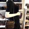 Vanity PM carried by a mannequin in the boutique