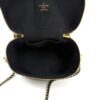Lid open showing the black lining and the interior stamp