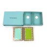 Both decks lifted out of the open Tiffany box