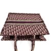 Top of the tote with the handles and woven band
