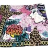 Corner of the scarf showing the printed face and flowers