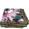 Scarf folded to show the leopard and monogram border