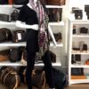 Scarf worn around the neck by a mannequin in the boutique