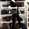 Heart bag worn crossbody on a mannequin in the boutique