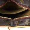 Interior opened showing the khaki lining and zip