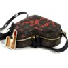 Side view with the lipstick charm hanging at the front