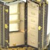 Close up through the glass at the open trunk drawers
