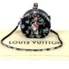 Boite Chapeau resting on its Louis Vuitton dust bag