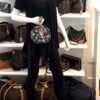 Mannequin carrying the round bag on the shoulder