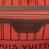 LOUIS VUITTON printed on the red striped lining