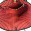 Interior zip pocket set into the red lining