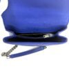 Flap opened to show the front zip pocket and blue leather