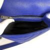 Interior zip pocket opened showing the black lining