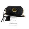 Bag shown with its Gucci receipt and care booklet