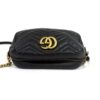 Three quarter with the chain and leather strap trailing