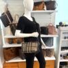 Crossbody worn on a mannequin in the boutique