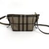 Three quarter view with the strap coiled beside
