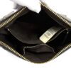 Interior opened by a gloved hand showing the lining