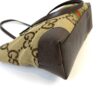 Side and base of the tote in GG canvas