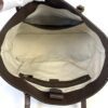 Interior held open showing the canvas lining and zip