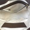 Interior zip pocket set into the canvas lining